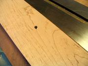 The hole on the face from the errant router bit.